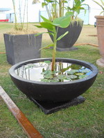 large garden water bowl on base, black volcanic scoria finish