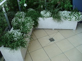 custom made to measure balcony planter troughs, ivory lava stone finish