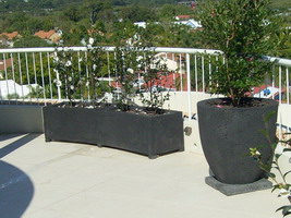 curved roof top garden planter troughs, black lava stone finish
