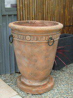 large tuscan planter pot with bronzed rings, aged terracotta semi formal finish on drip tray plinth