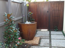 large custom water feature pot, semi formal iron verdi finish