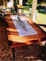 Custom table with kwela edge and mosaic panel on wrought iron base