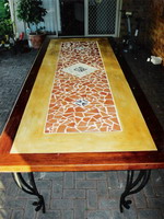 Custom table with kwela edge and mosaic panel on wrought iron base