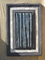 Black lava stone finish wall plaque with travertine tile insert and copper verdi bamboo relief