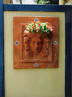 Roman woman Imogen wall plaque and planter with hand painted tiles, aged terracotta semi formal finish.