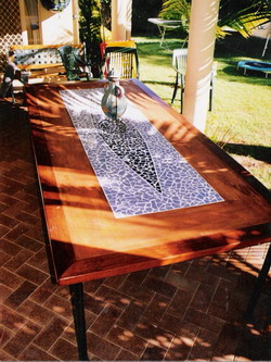 Potanico are creators of custom outdoor garden tables and chairs with mosaics, slump glass and wrought iron.