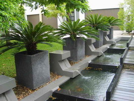 custom made commercial large square planters, charcoal lava stone finish