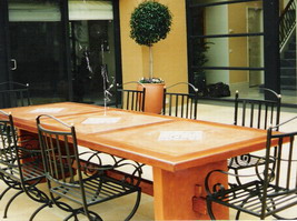 Tuscan courtyard table, kwela edge, terracotta and tile panels, curved terracotta legs and timber cross braces and wedges